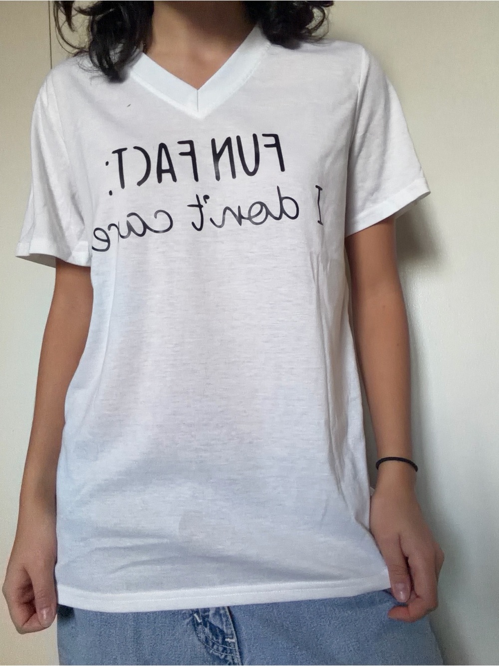 White V-Neck Short Sleeve Tee with 'FUN FACT I DONT CARE’ Graphic